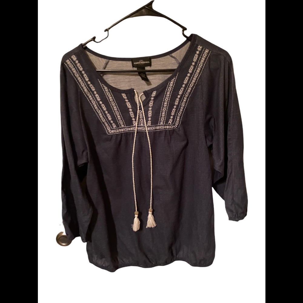 Denim colored long sleeved top with white tassels and embroidery. Size medium.